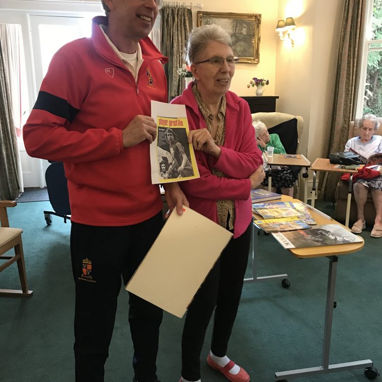 Resident poses with former Shrewsbury Town player at Maesbrook care home as part of Meadow Memories