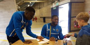 Shrewsbury Town players sign autographs